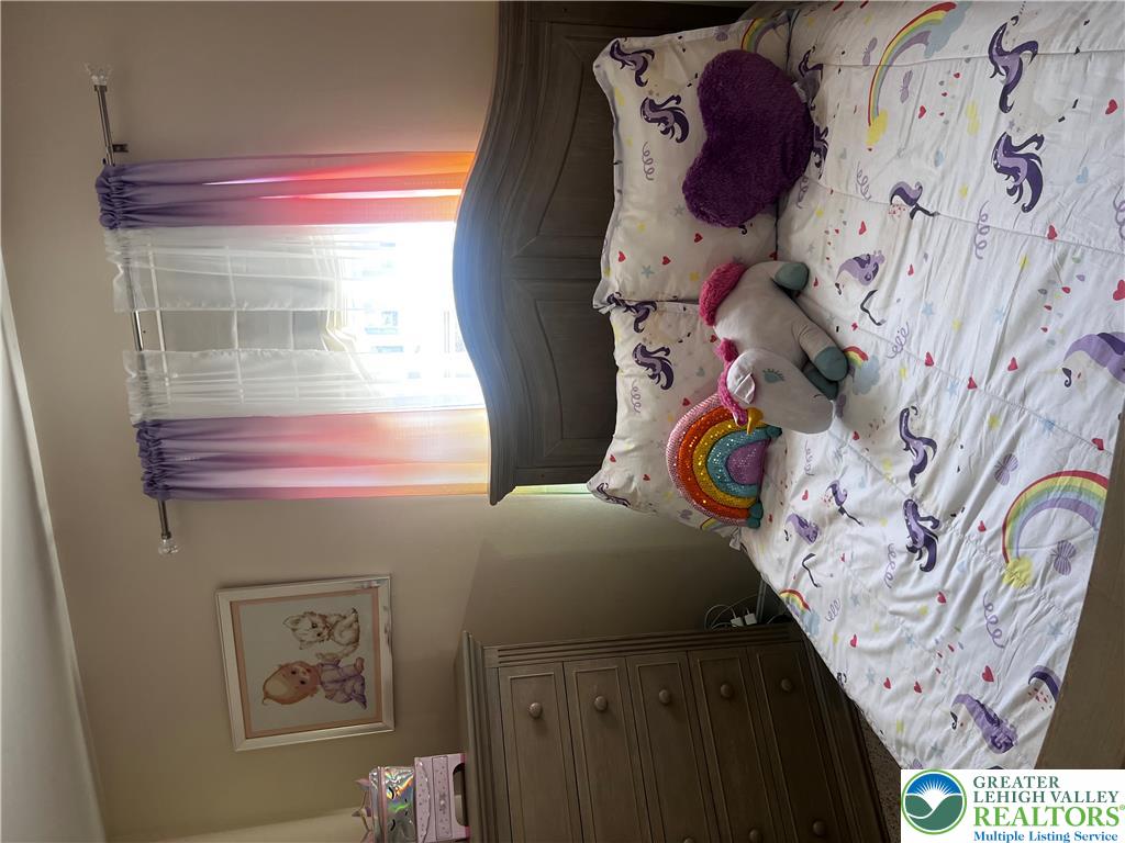 8549 Gateway Road Breinigsville, PA 18031 - Photo 25 of 26 A cozy, sun-filled bedroom offers a tranquil retreat for rest and relaxation.