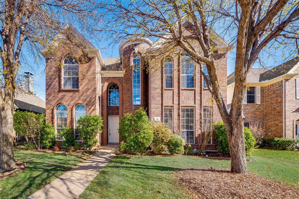 Tudor home featuring a front yard