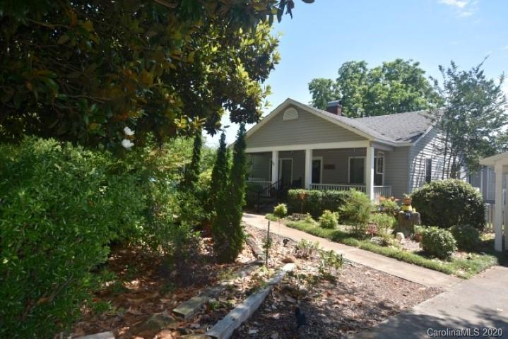 294 Church Street Rutherfordton, NC 28139 - Photo 1 of 29 a front view of a house with a yard and potted plants