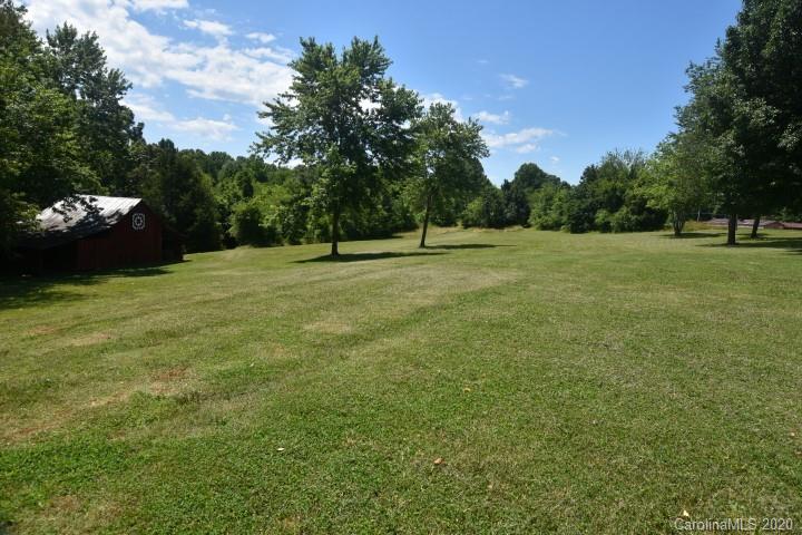 294 Church Street Rutherfordton, NC 28139 - Photo 3 of 29 a view of a field of grass and trees