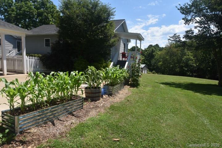 294 Church Street Rutherfordton, NC 28139 - Photo 25 of 29 a view of a garden with a fountain