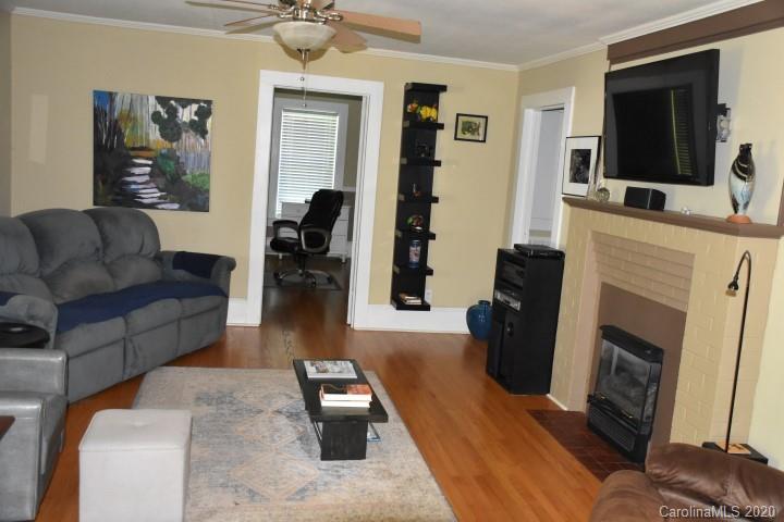 294 Church Street Rutherfordton, NC 28139 - Photo 8 of 29 a living room with furniture and a fireplace