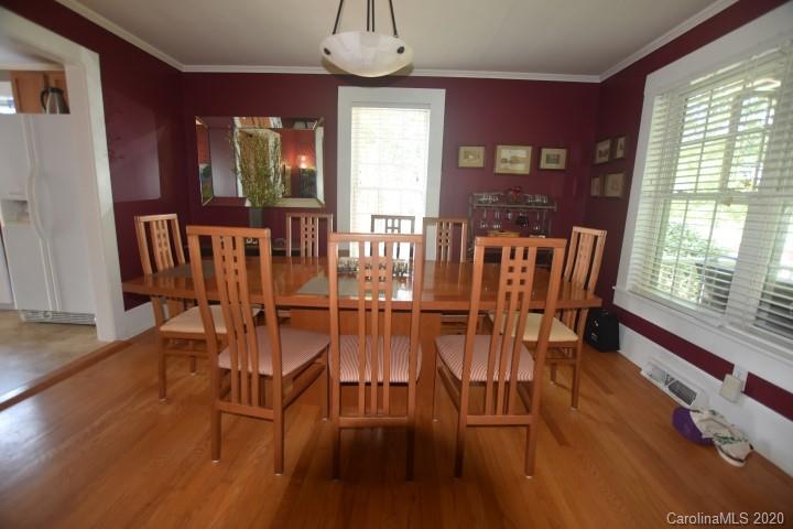 294 Church Street Rutherfordton, NC 28139 - Photo 9 of 29 a view of a dining room with furniture window and wooden floor
