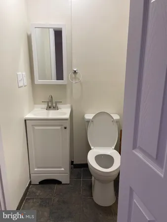 a bathroom with a toilet and a sink