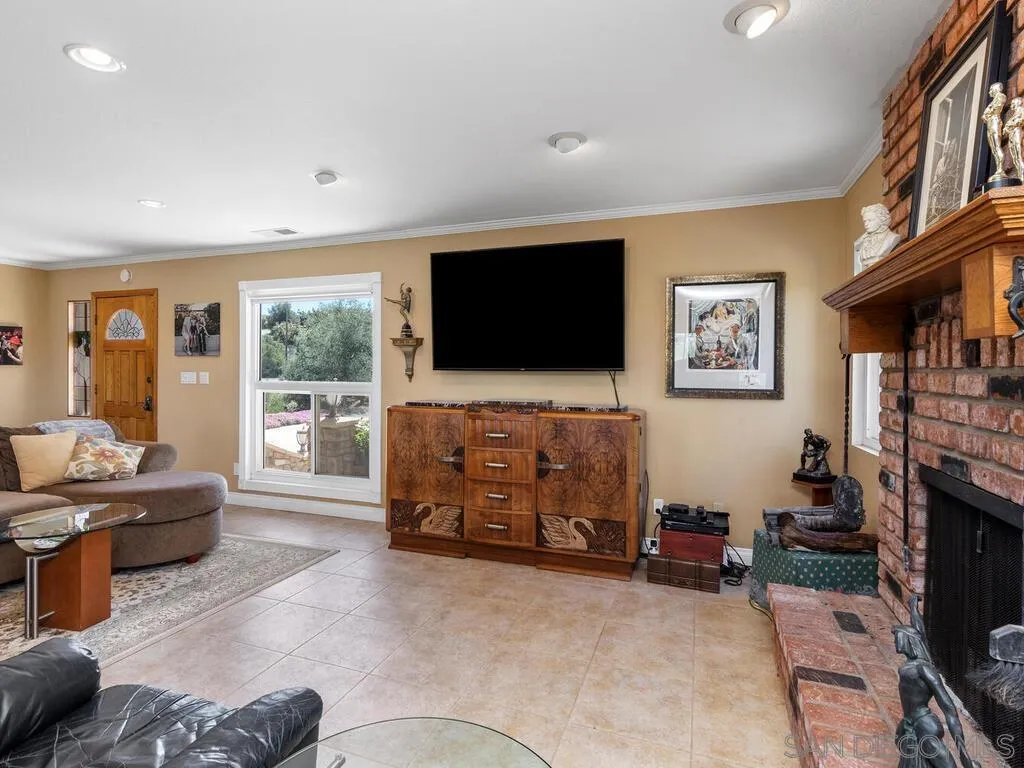 29513 Anthony Road Valley Center, CA 92082 - Photo 12 of 59 a living room with furniture and a flat screen tv