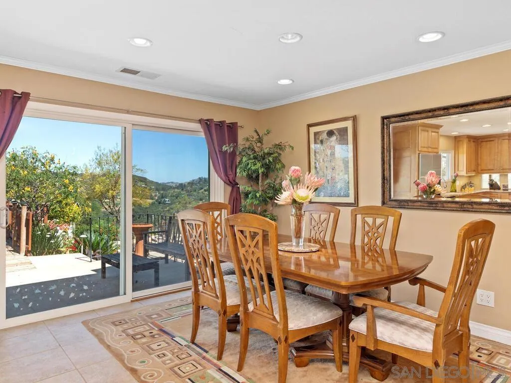 29513 Anthony Road Valley Center, CA 92082 - Photo 18 of 59 a dining room with furniture and wooden floor