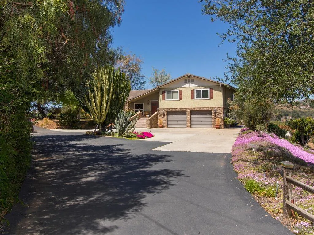29513 Anthony Road Valley Center, CA 92082 - Photo 2 of 59 a front view of a house with a yard