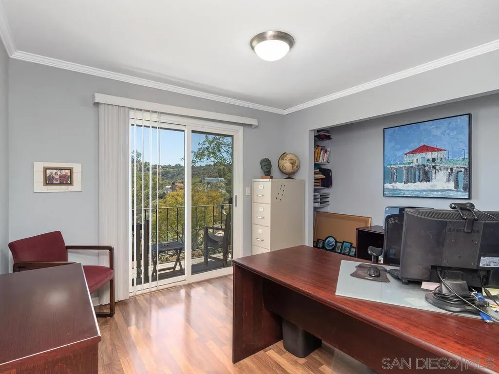 29513 Anthony Road Valley Center, CA 92082 - Photo 23 of 59 a view of a workspace with furniture and a window