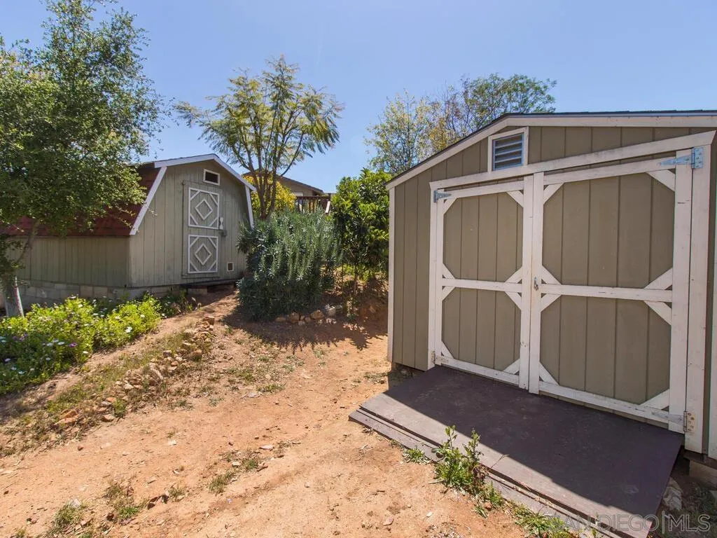29513 Anthony Road Valley Center, CA 92082 - Photo 39 of 59 a front view of a house with garden