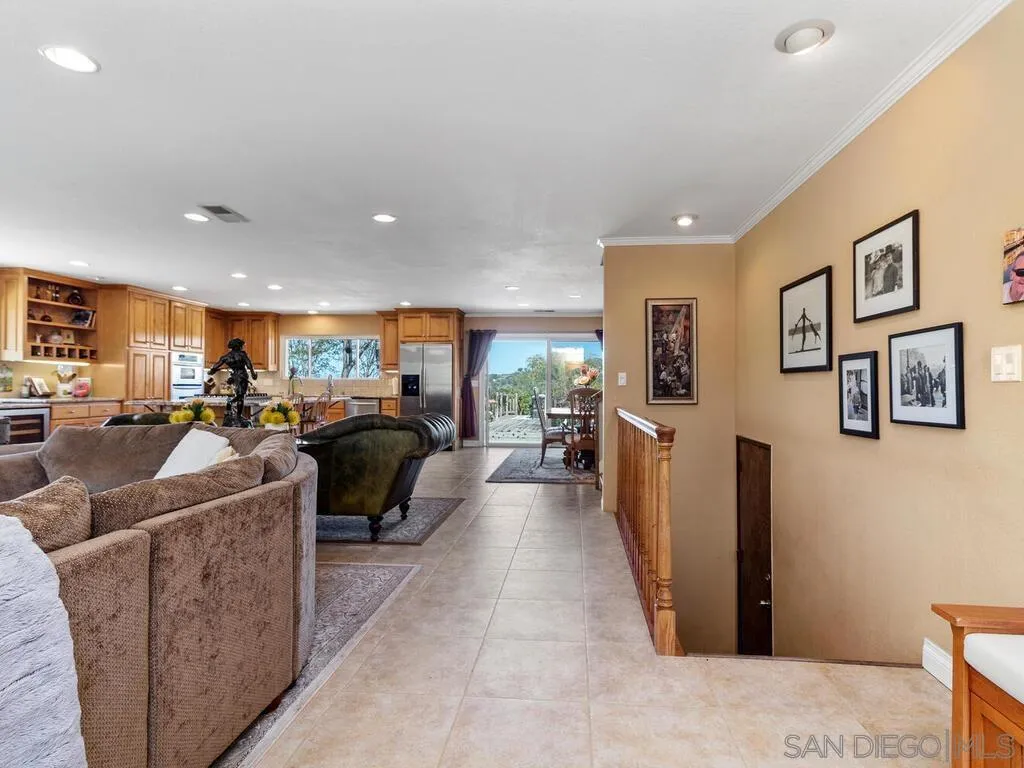29513 Anthony Road Valley Center, CA 92082 - Photo 8 of 59 a living room with furniture kitchen view and a refrigerator