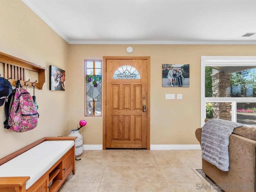 29513 Anthony Road Valley Center, CA 92082 - Photo 9 of 59 a bedroom with furniture and a window