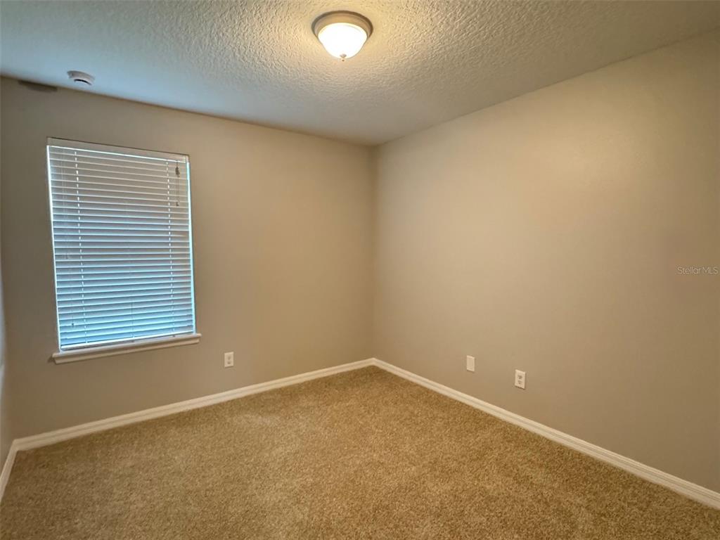 6320 Windsor Lake Circle Sanford, FL 32773 - Photo 14 of 18 an empty room with a window