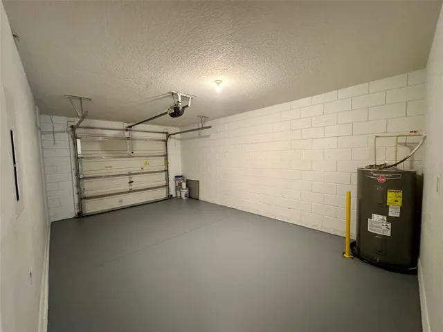 a view of room that has a bed and room