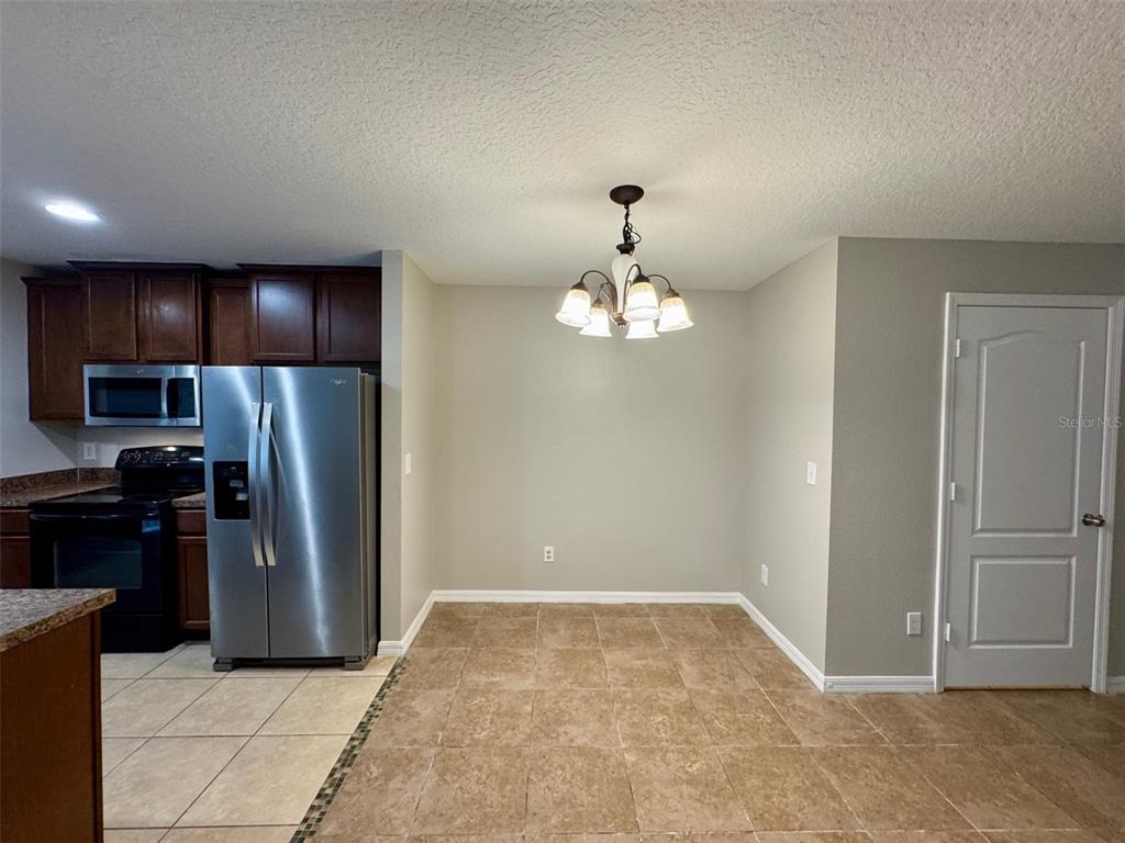 6320 Windsor Lake Circle Sanford, FL 32773 - Photo 5 of 18 a view of a kitchen with a sink and refrigerator