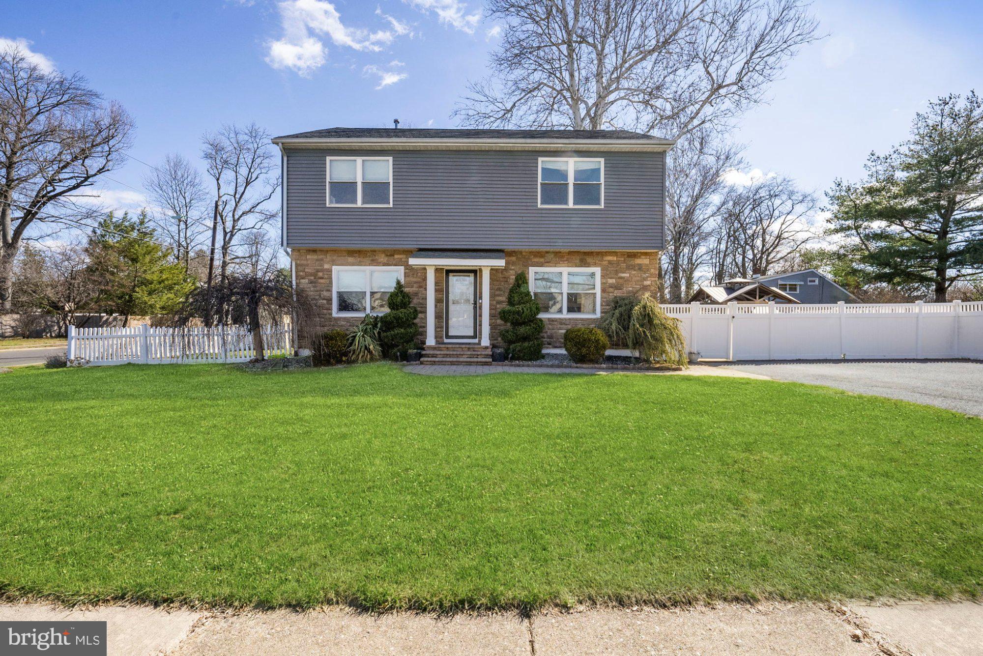 244 Manor Boulevard Hamilton, NJ 08620 - Photo 1 of 42 a view of a brick house with a yard