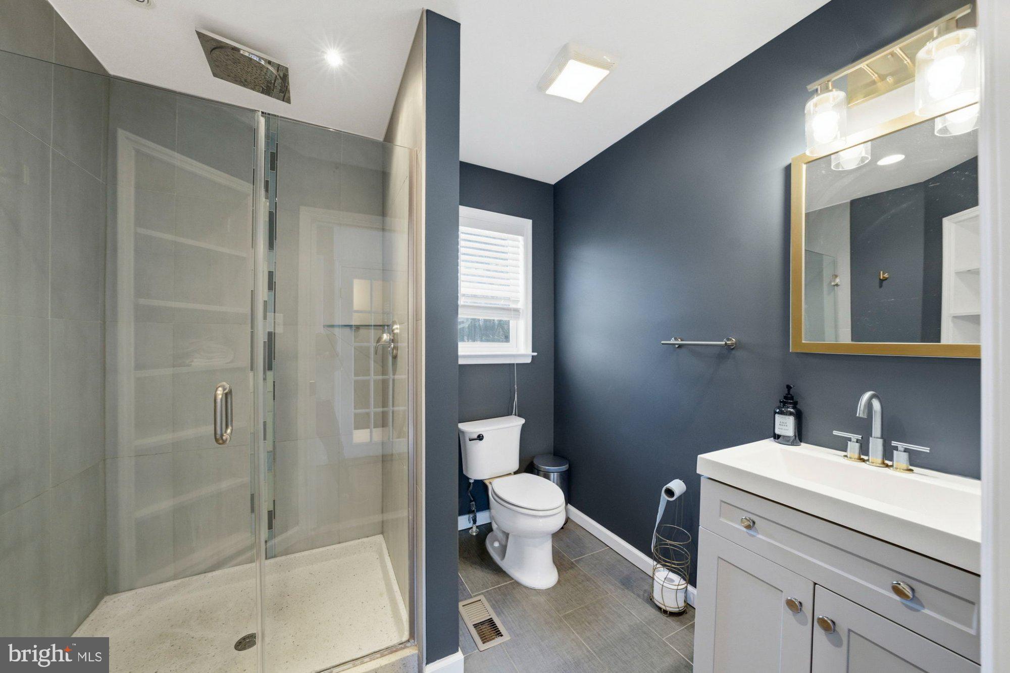 244 Manor Boulevard Hamilton, NJ 08620 - Photo 23 of 42 a bathroom with a shower sink mirror and toilet