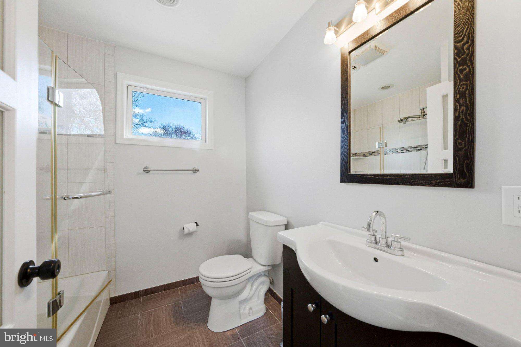 244 Manor Boulevard Hamilton, NJ 08620 - Photo 24 of 42 a bathroom with a sink a toilet and shower