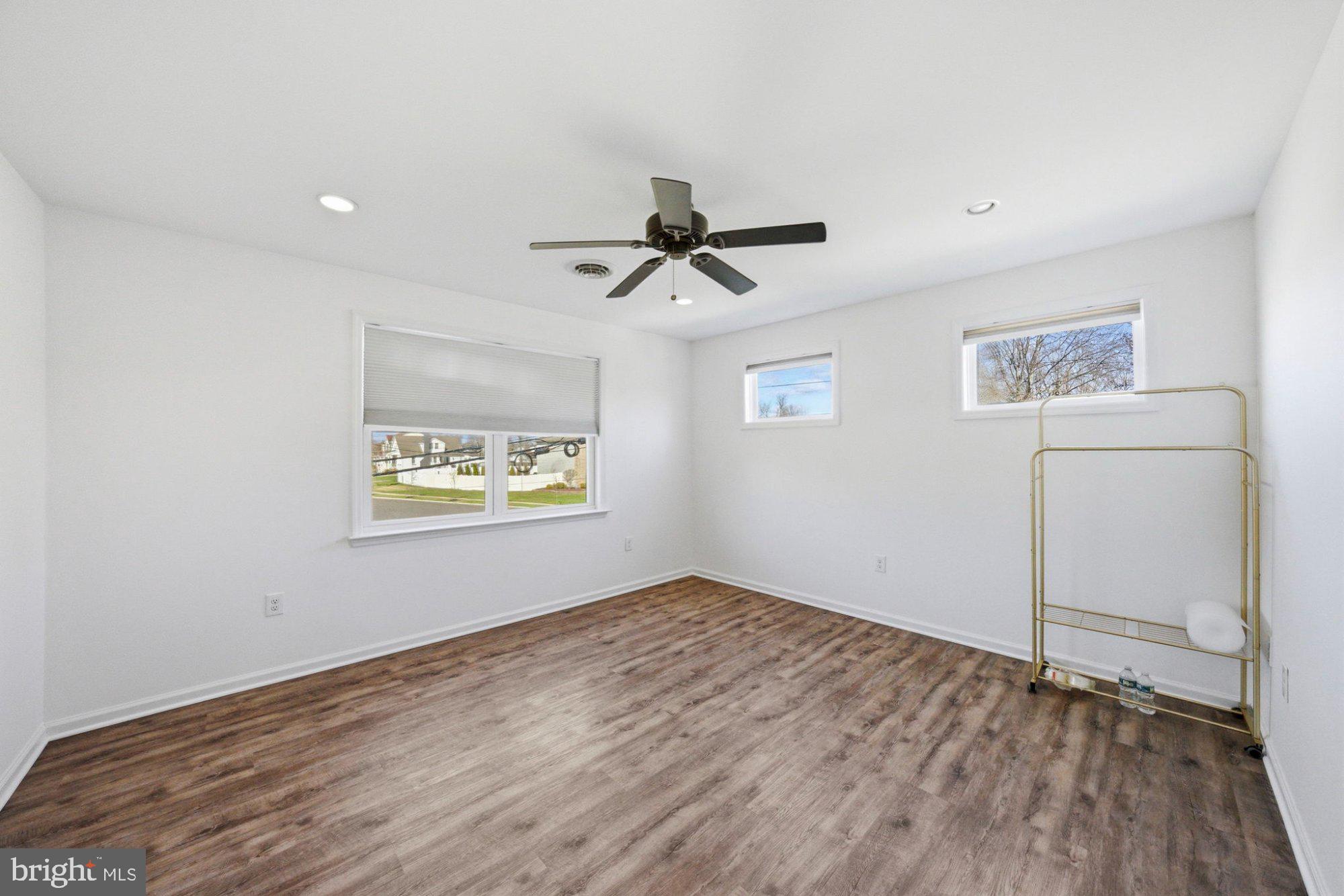 244 Manor Boulevard Hamilton, NJ 08620 - Photo 25 of 42 a view of an empty room with window and wooden floor