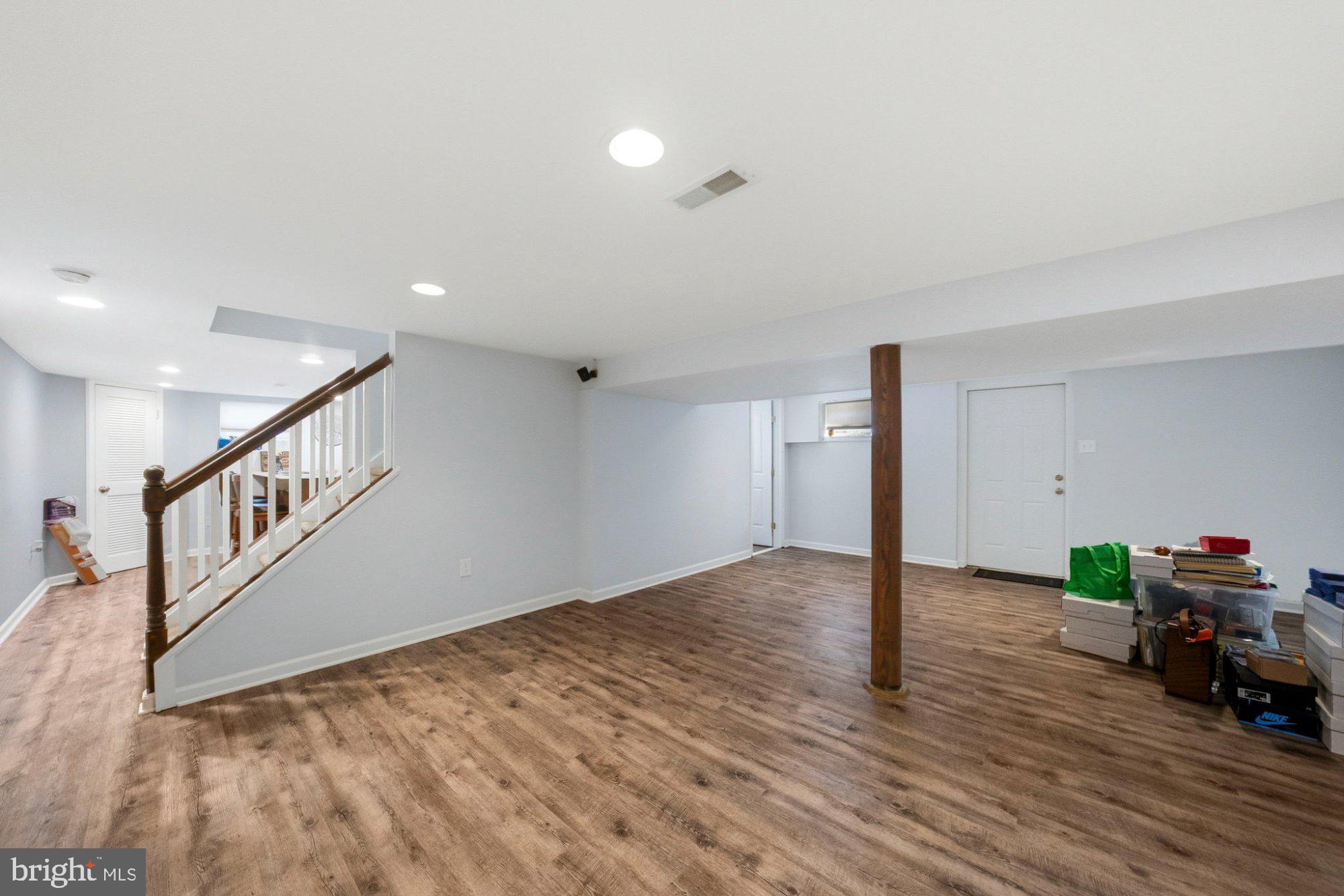 244 Manor Boulevard Hamilton, NJ 08620 - Photo 30 of 42 a view of an empty room with wooden floor and a window