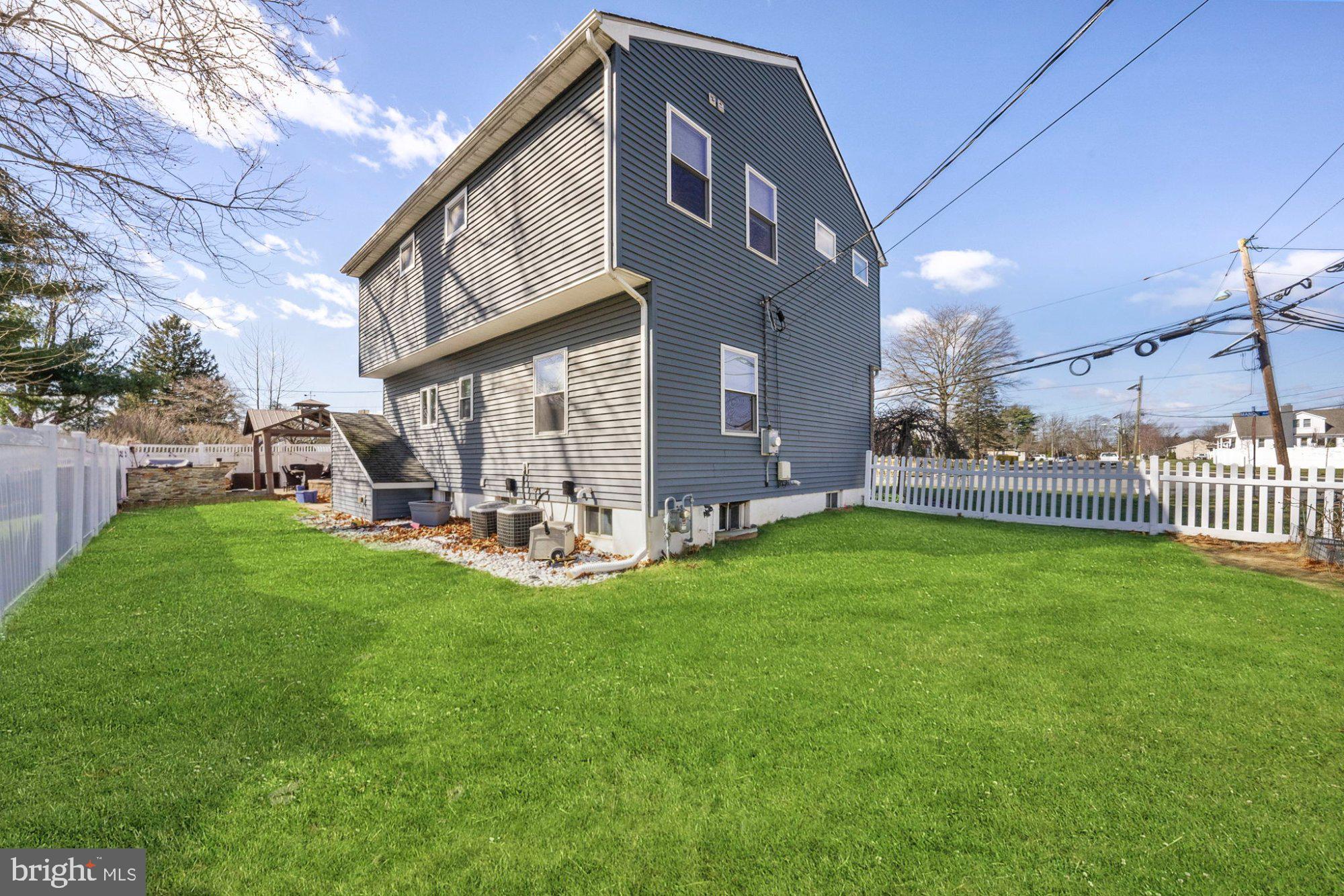 244 Manor Boulevard Hamilton, NJ 08620 - Photo 5 of 42 a view of a house with a yard and deck