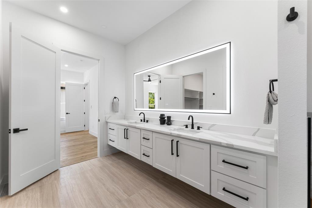 2828 Rochester Street Dallas, TX 75215 - Photo 17 of 36 Full bathroom with double vanity, light wood-style floors, and recessed lighting