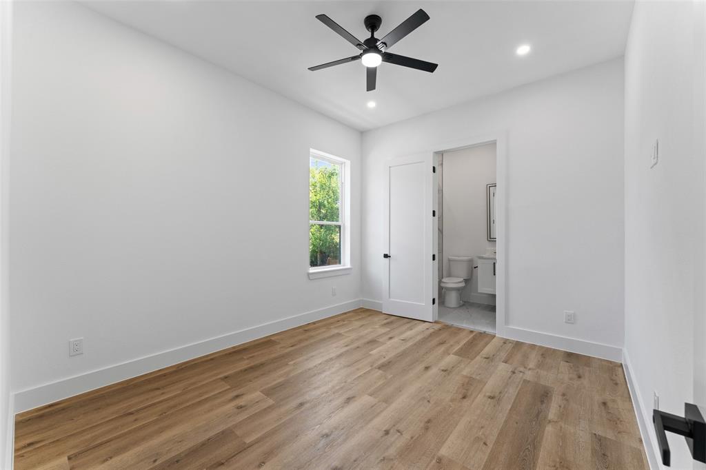 2828 Rochester Street Dallas, TX 75215 - Photo 19 of 36 Unfurnished bedroom with light wood finished floors, a ceiling fan, ensuite bath, and recessed lighting