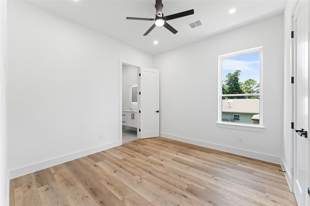 2828 Rochester Street Dallas, TX 75215 - Photo 26 of 36 Unfurnished bedroom with light wood-style flooring, ceiling fan, ensuite bathroom, and recessed lighting