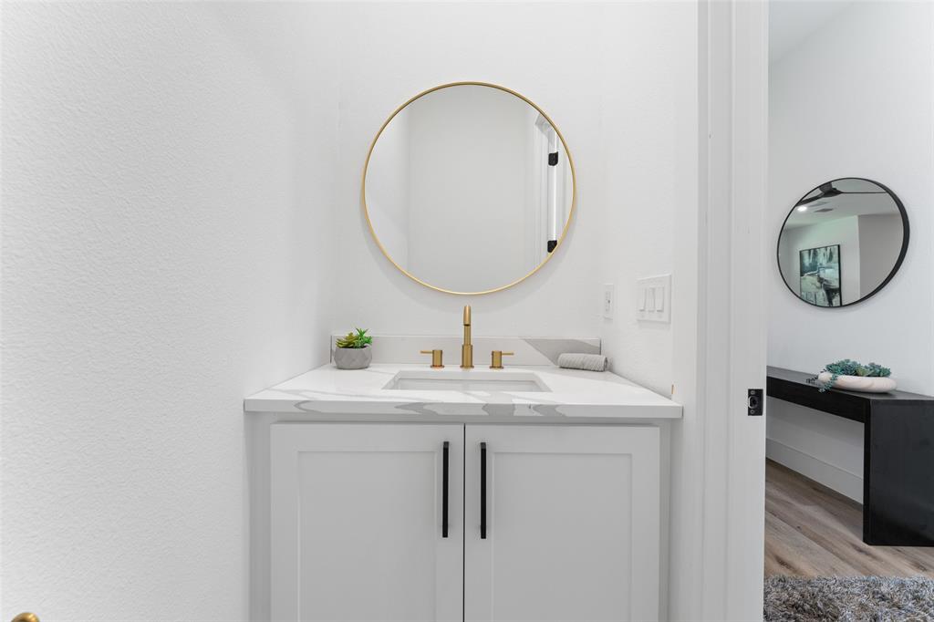 2828 Rochester Street Dallas, TX 75215 - Photo 27 of 36 Bathroom featuring vanity and light wood-style flooring