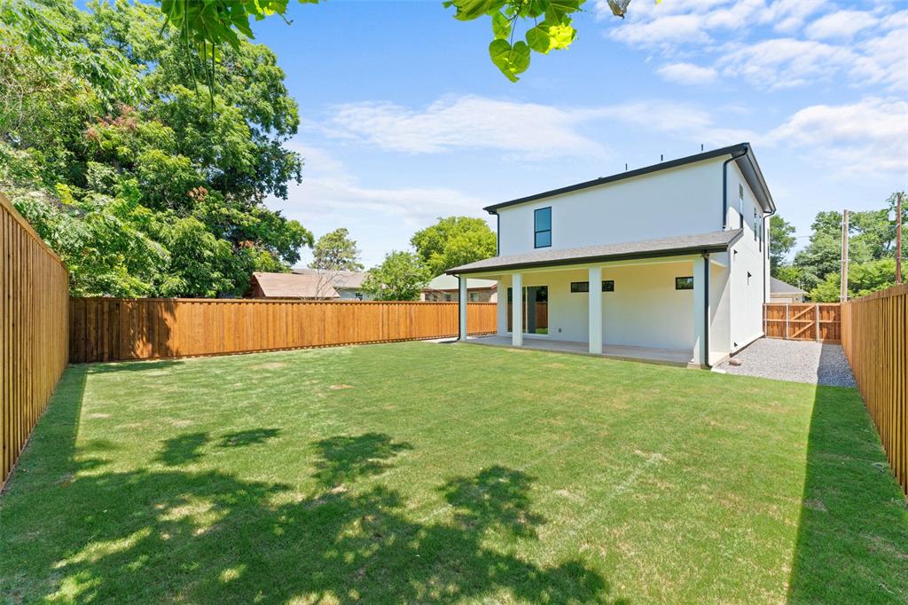 2828 Rochester Street Dallas, TX 75215 - Photo 32 of 36 Rear view of property with a fenced backyard, a patio area, and stucco siding