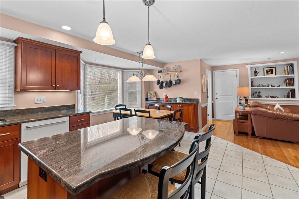 52 Pitt Road Framingham, MA 01701 - Photo 13 of 41 a kitchen with granite countertop lots of counter top space and dining table