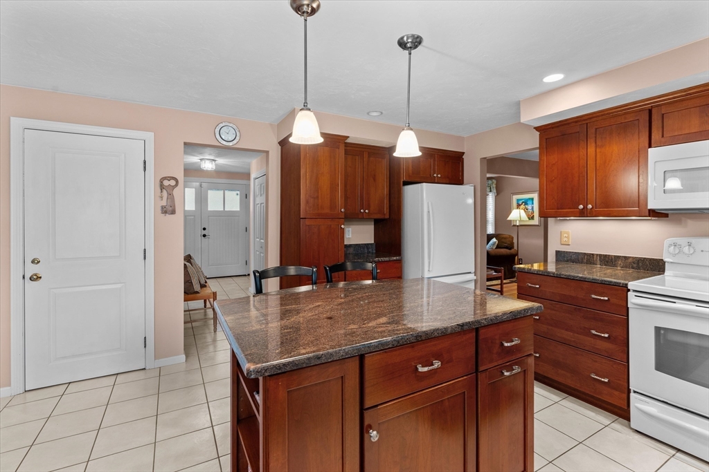52 Pitt Road Framingham, MA 01701 - Photo 16 of 41 a kitchen with stainless steel appliances granite countertop a sink a stove and a refrigerator
