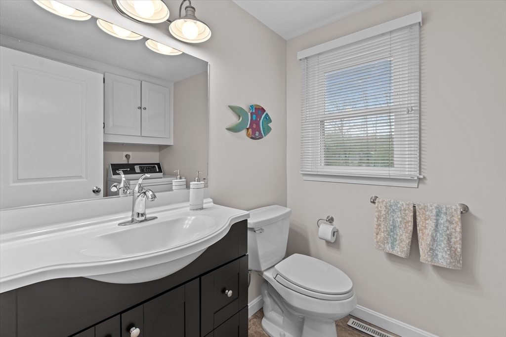 52 Pitt Road Framingham, MA 01701 - Photo 18 of 41 a bathroom with a sink a toilet a mirror and shower