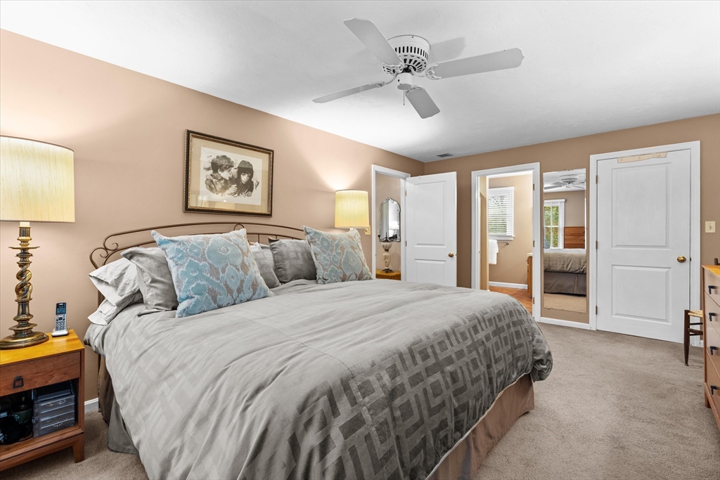 52 Pitt Road Framingham, MA 01701 - Photo 28 of 41 a spacious bedroom with a bed a ceiling fan and a dresser