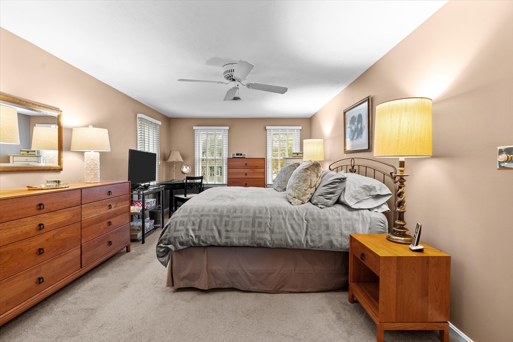 52 Pitt Road Framingham, MA 01701 - Photo 31 of 41 a spacious bedroom with a bed and wooden floor