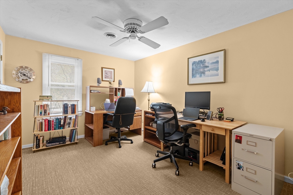 52 Pitt Road Framingham, MA 01701 - Photo 32 of 41 a view of a workspace with furniture and a ceiling fan