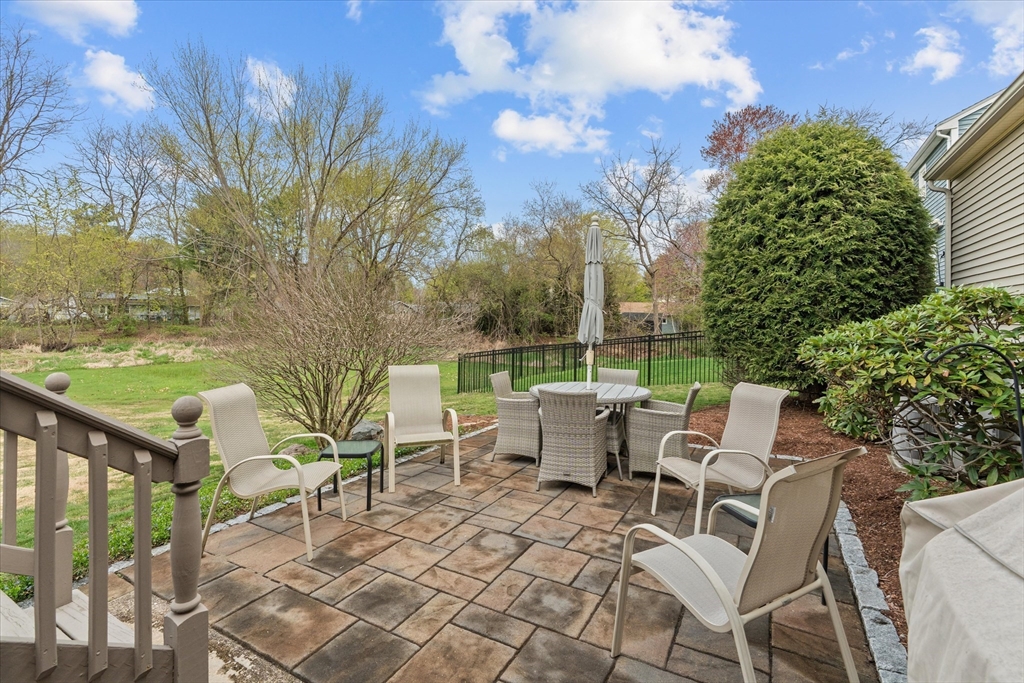52 Pitt Road Framingham, MA 01701 - Photo 35 of 41 a view of a patio with table and chairs and potted plants