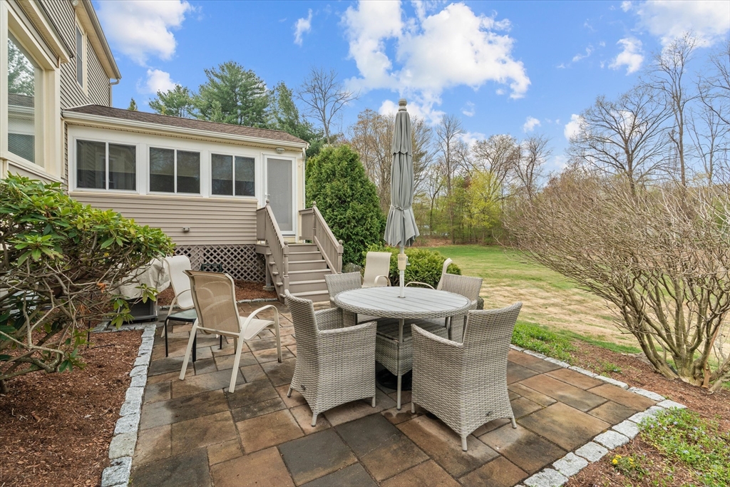 52 Pitt Road Framingham, MA 01701 - Photo 36 of 41 a view of a patio with table and chairs and potted plants