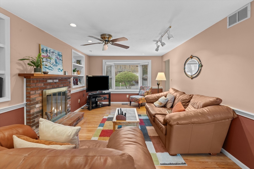 52 Pitt Road Framingham, MA 01701 - Photo 8 of 41 a living room with furniture fireplace and a flat screen tv