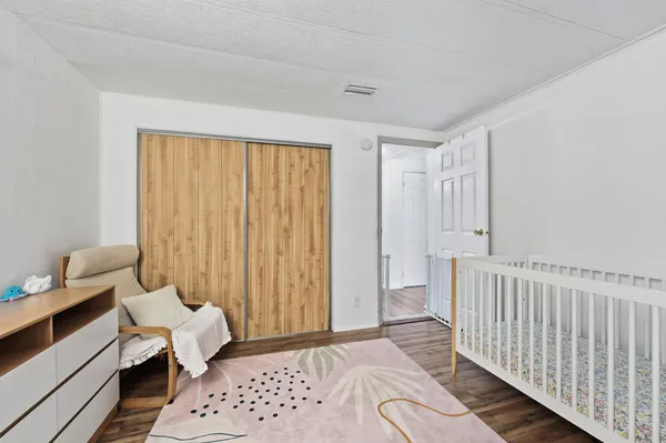 a bedroom with furniture and a window