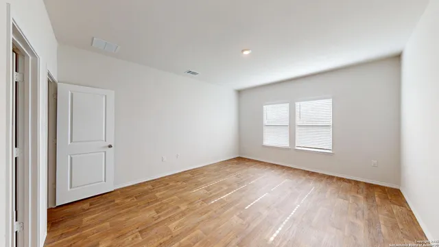 a bathroom with a double vanity sink and toilet