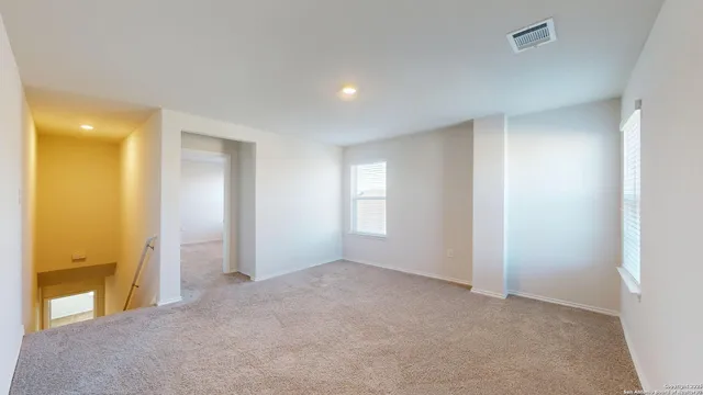 a view of an empty room and window