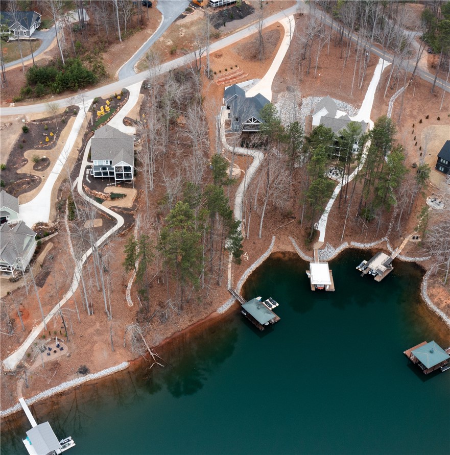 Lot 17 Retreat Pointe Road West Union, SC 29696 - Photo 11 of 22 This captivating aerial view showcases a serene lakeside community with homes nestled among mature trees.