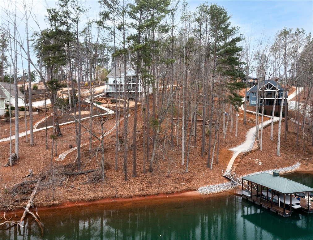 Lot 17 Retreat Pointe Road West Union, SC 29696 - Photo 19 of 22 This scenic waterfront property features a private boat dock and wooded surroundings.