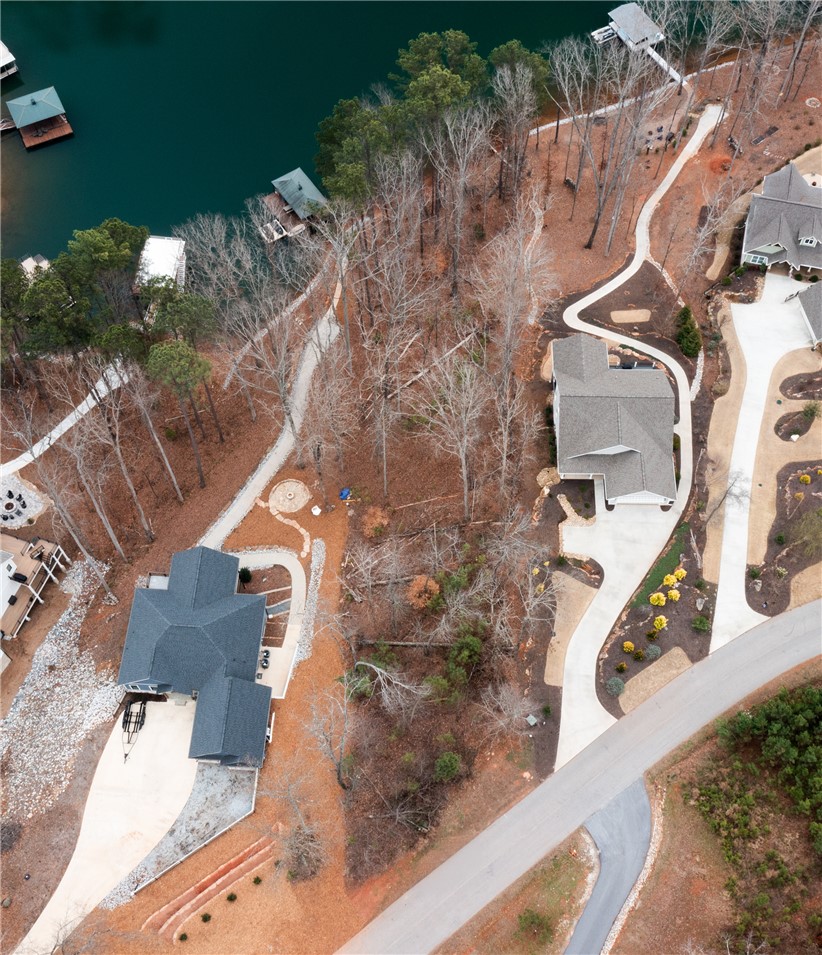 Lot 17 Retreat Pointe Road West Union, SC 29696 - Photo 9 of 22 An aerial perspective reveals a beautiful waterfront property with private boat access and a winding driveway.