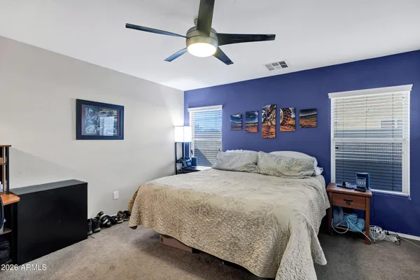 a bathroom with a shower sink and mirror