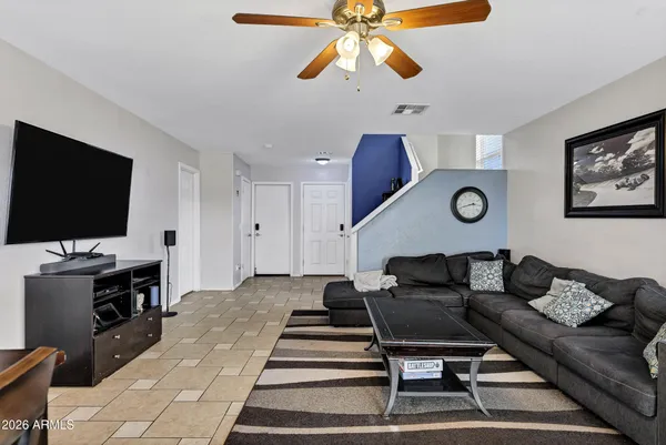 a living room with furniture and a flat screen tv