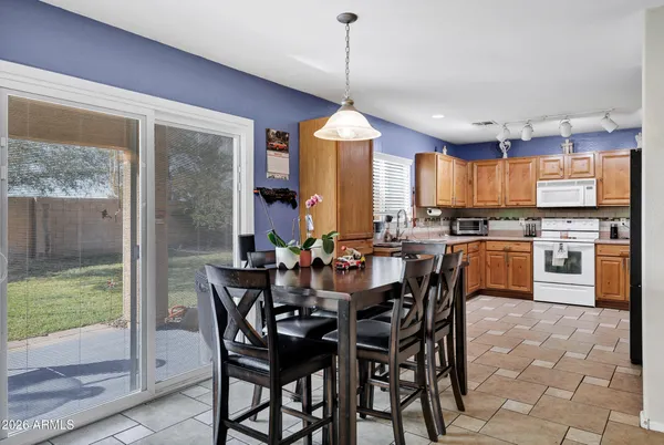 a view of a dining room with furniture window and outside view