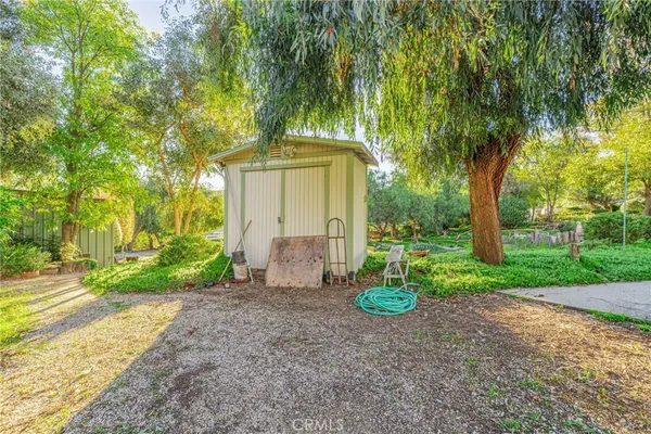a view of a house with a tree in the background