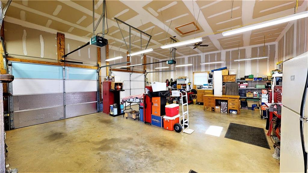 172 Deerfield Country Road Randleman, NC 27317 - Photo 25 of 30 Garage/shop has incredible space for hobbies/cars/motorcycles/bicycles!! Heated and cooled! Don't forget about the wired outbuilding in back yard!