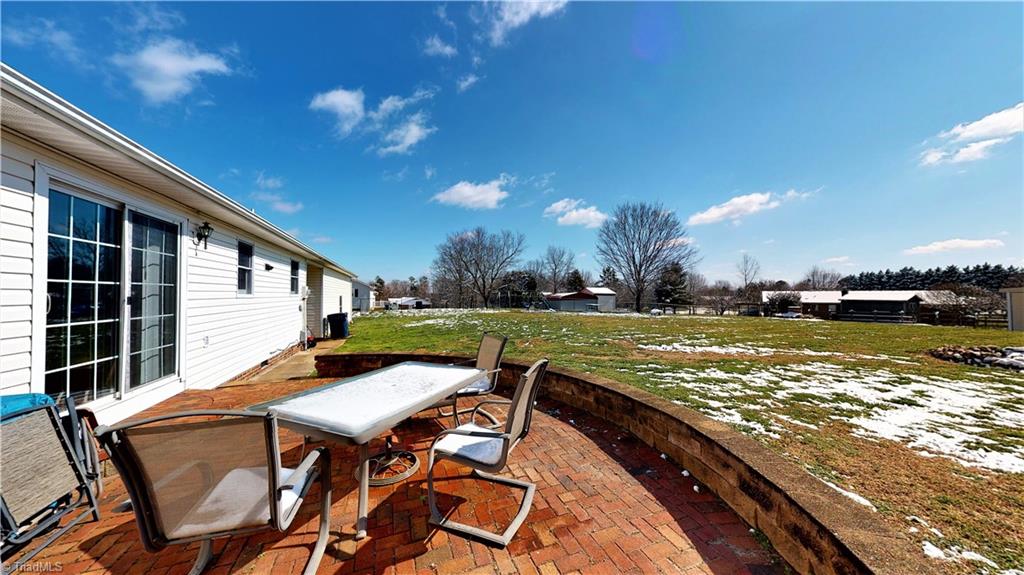 Patio leads to sliding glass doors at dining area - great for entertaining!
